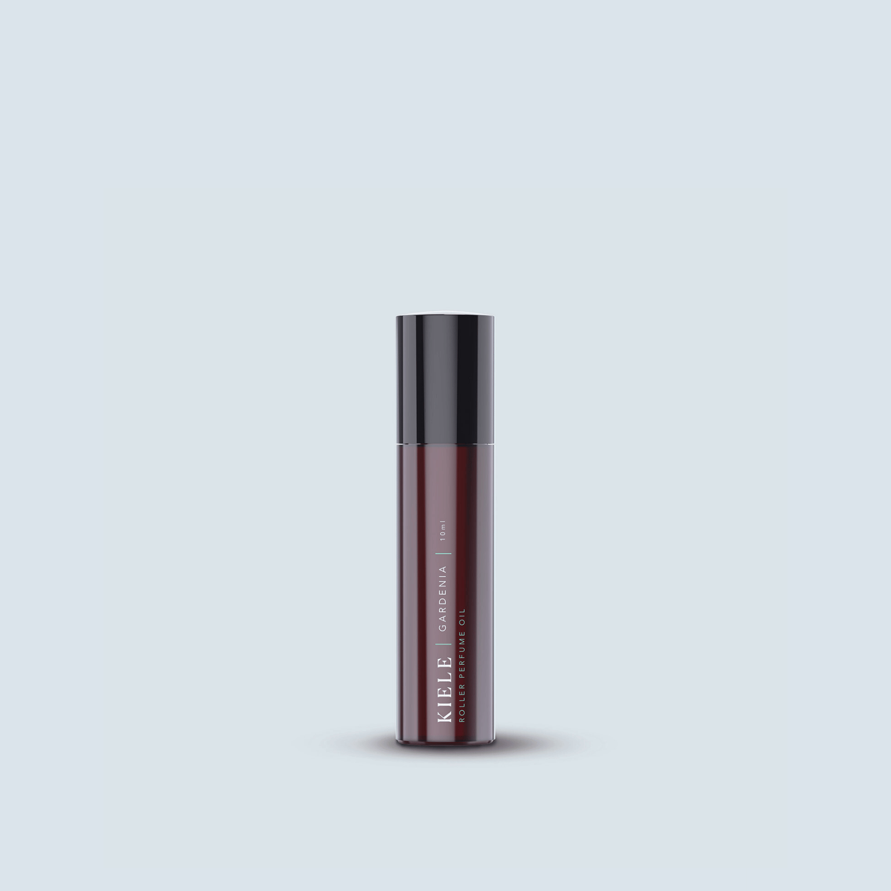 Iliahi Sandalwood Roller Perfume on blue background